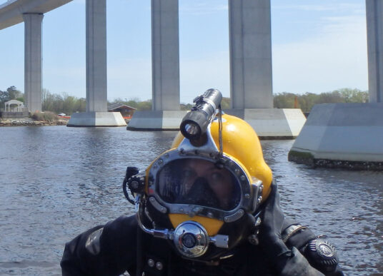 A diver in front of the Jordan Bridge