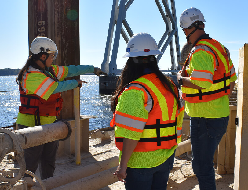 A KCI employee explains the process of bridge construction