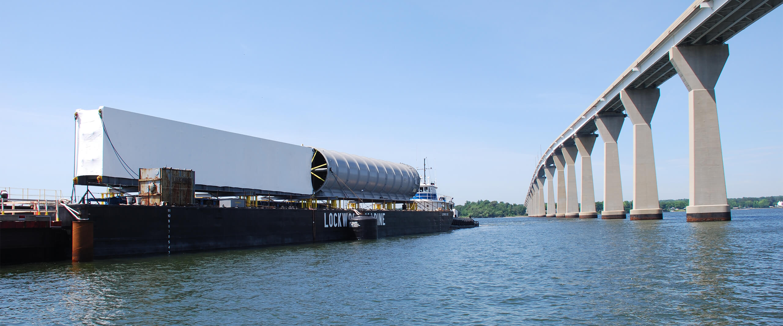 A barge next to a bridge