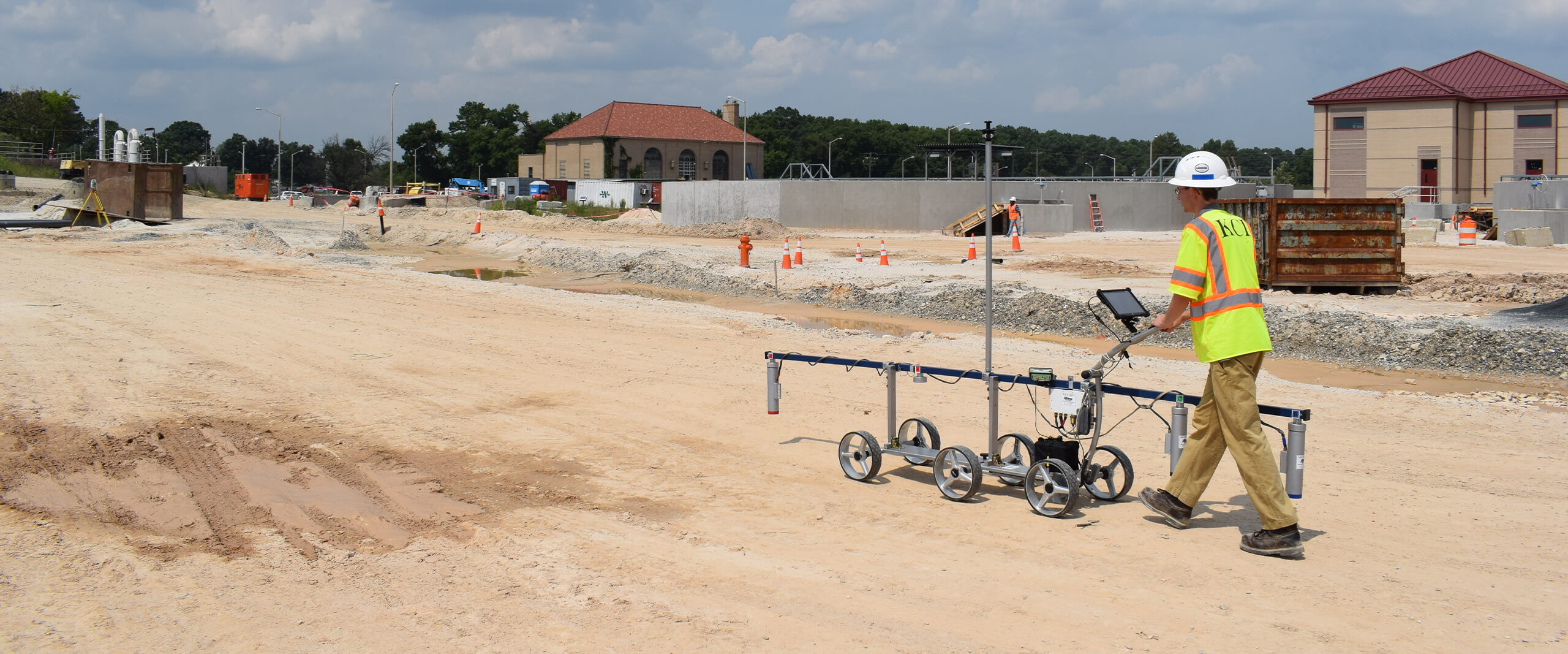 A KCI employee uses the AM Gradiometer device to perform geotechnical engineering