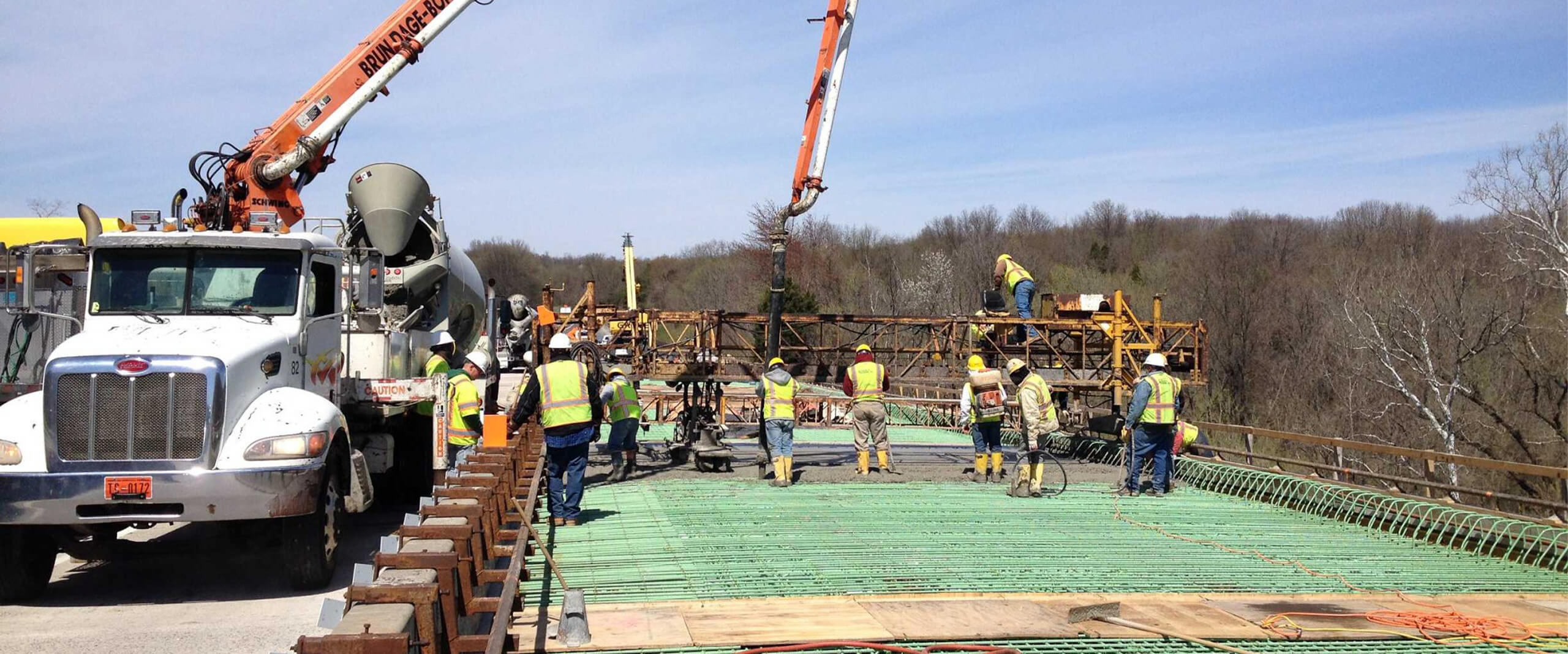 A crane placing pieces of the I-70 bridge into place