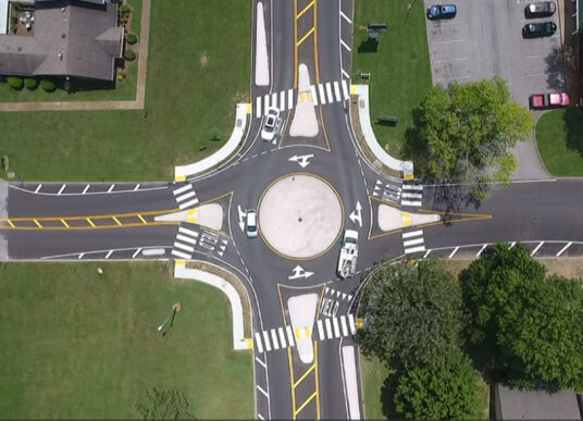 An aerial view of the mini roundabout at Sawyer Brown Road and Todd Preis Drive