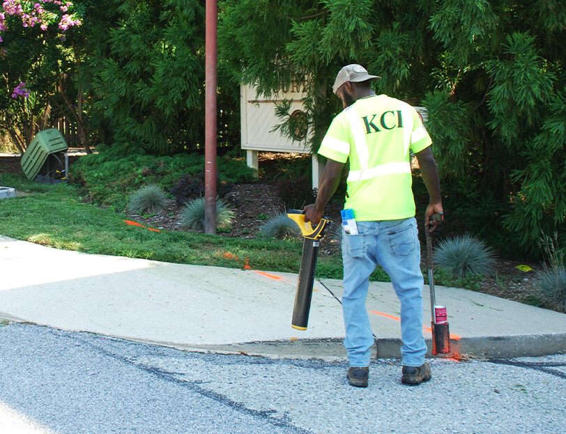 A KCI employee performs subsurface utility engineering