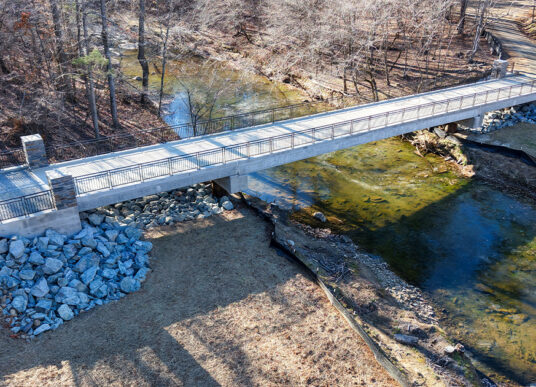Aerial view of the new bridge from the Duke Forest stream restoration project crossing the creek