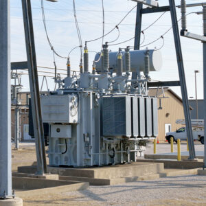 Electrical substation with a large power transformer and transmission structures