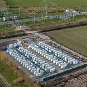 Aerial view of a utility-scale battery energy storage system installed in an open field