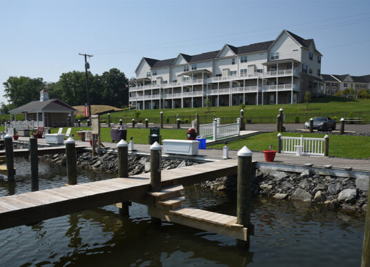 Marina docks and townhomes at the Devonport and Chrismar waterfront site development in Middle River, Maryland