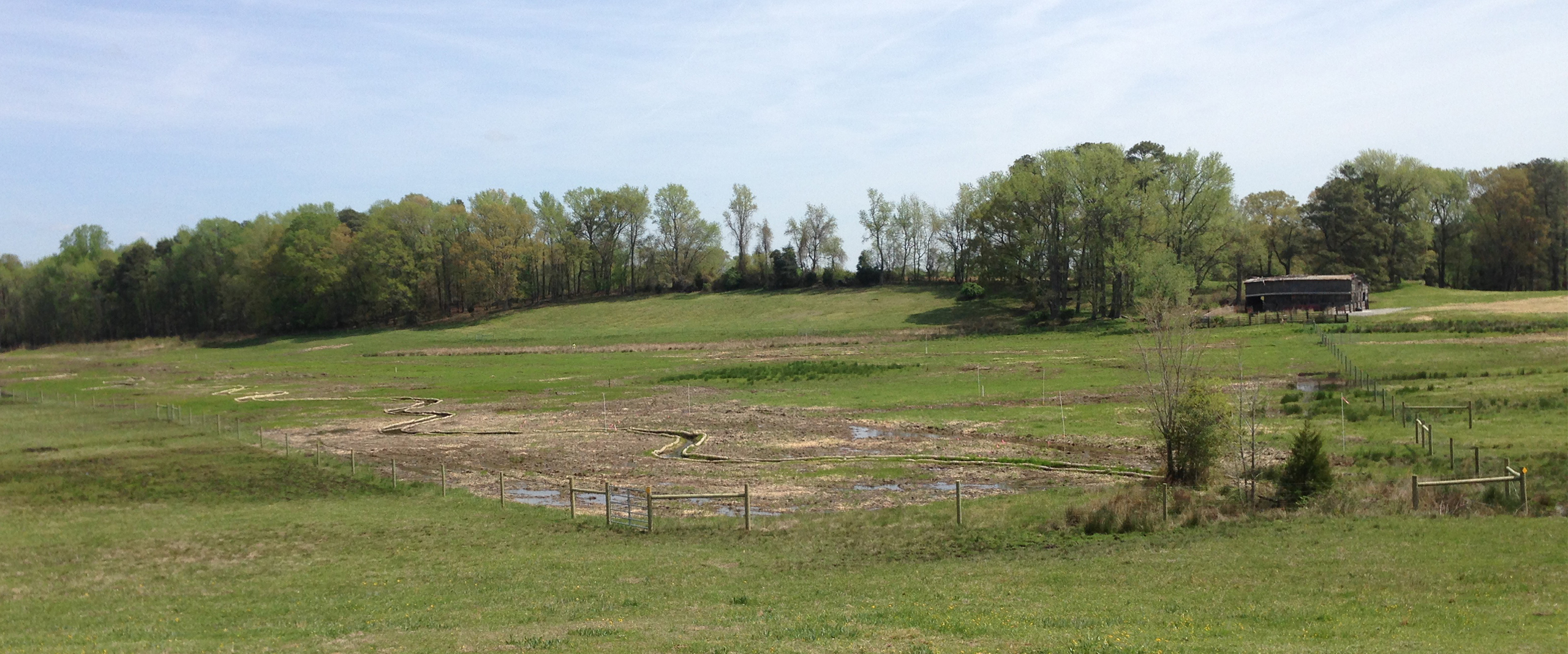 Graded wetland area with erosion control and fencing at Stanley's Slough in Northampton County, North Carolina